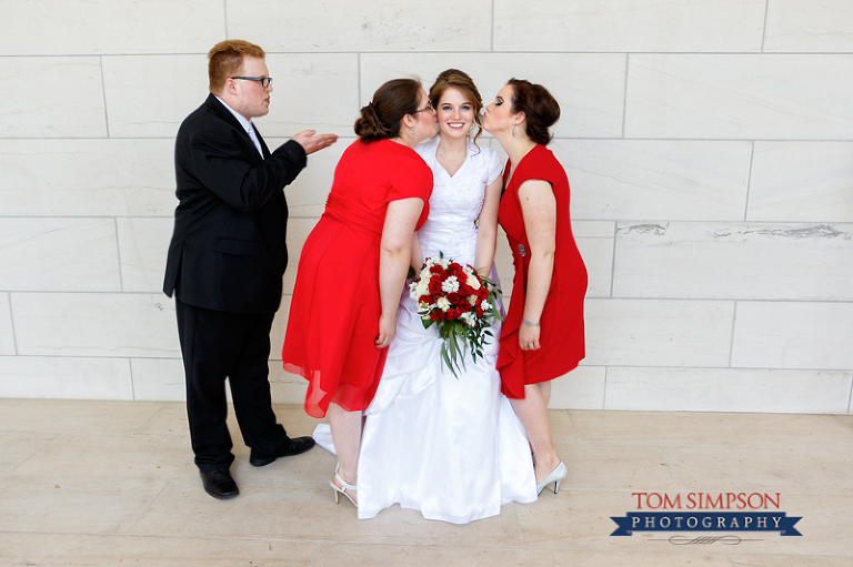 red rose bridal bouquet siblings wedding photo