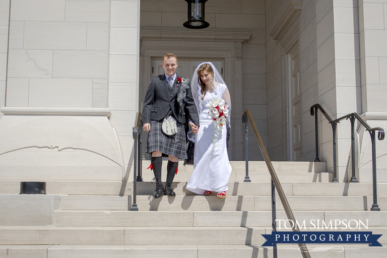 bride with groom in kilt nauvoo temple steps