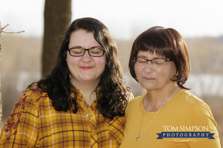 mother daughter making face