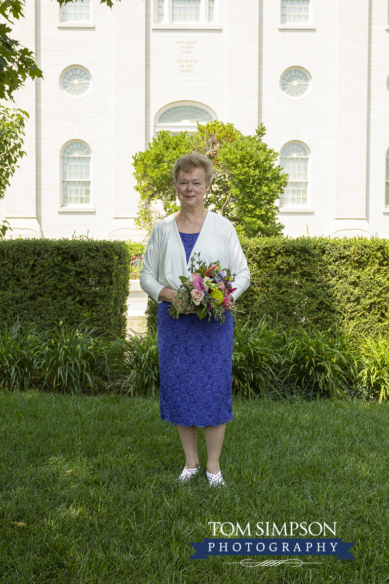 bride in blue nauvoo temple grounds
