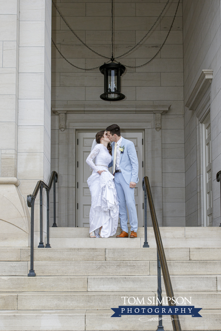 bride groom kissing nauvoo temple steps