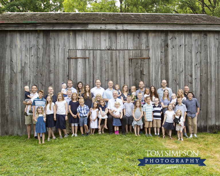 family group portrait old gray barn