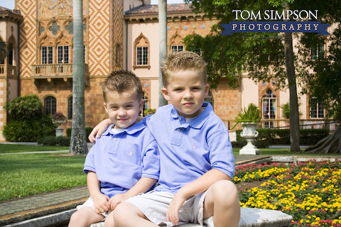 boys in blue in front of ringling mansion